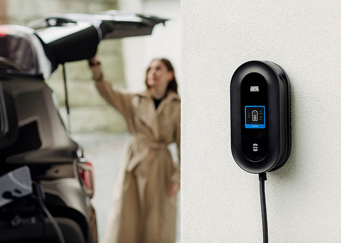 defa power ev charger with woman in the background