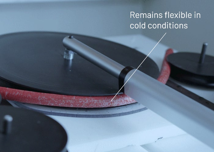 EV cable during bend test in cold chamber with text: Remains flexible in cold conditions.