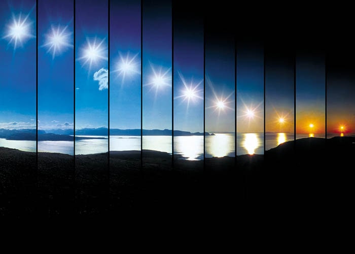 The midnight sun reflected in a window.