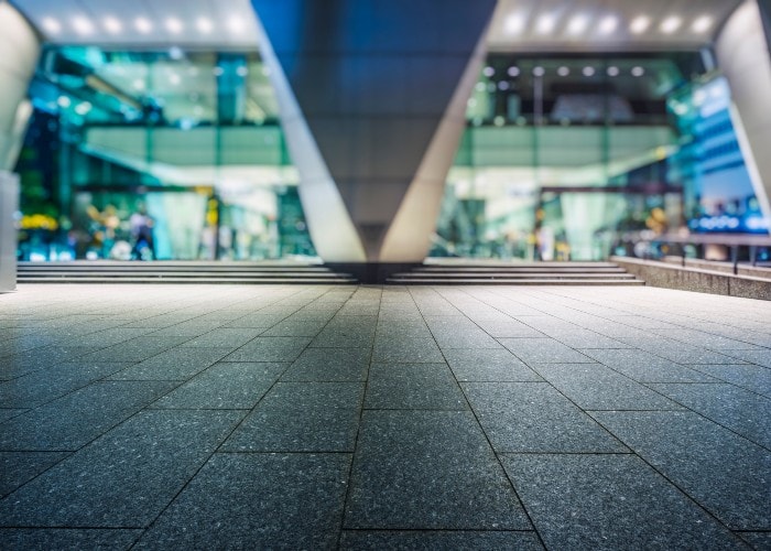 Well-lit entrance area of a modern office building at night