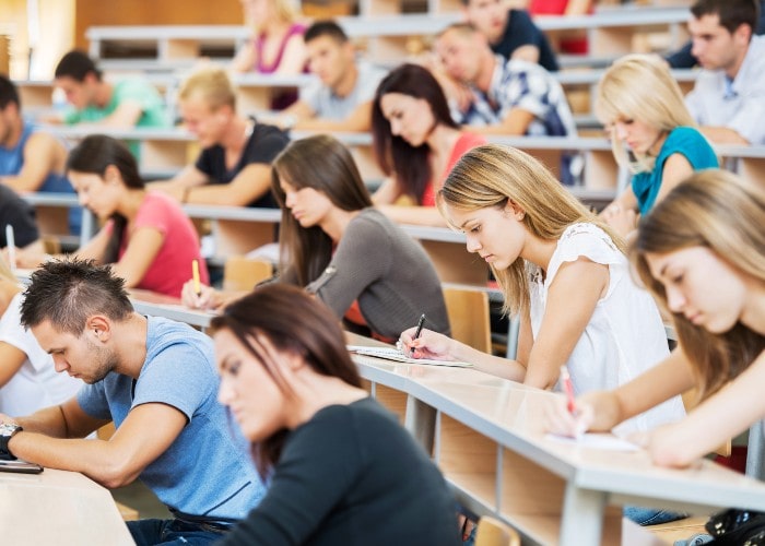 Students working in auditorium