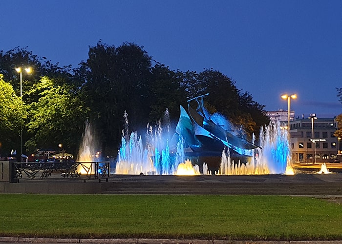 Multi colored lighting of the Whalers monument in Sandefjord