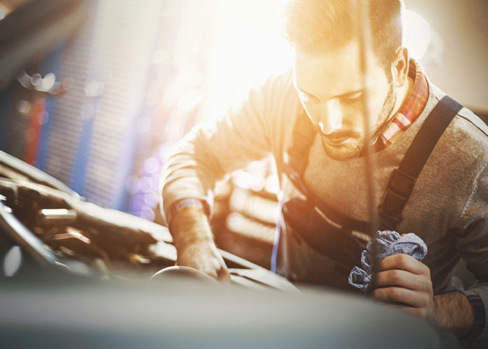 Car mechanic working on a car