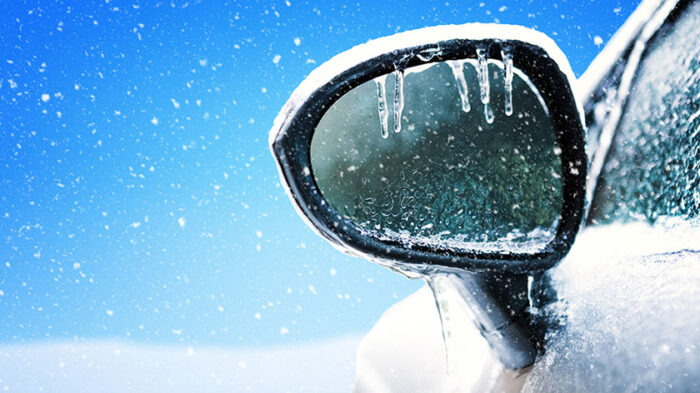 The frozen side mirror of a car.